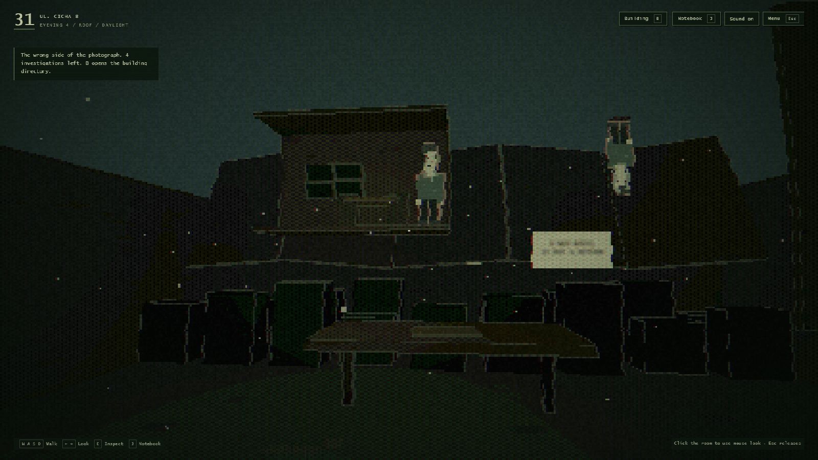 The apartment building's roof at night, with a kitchen hanging in the sky